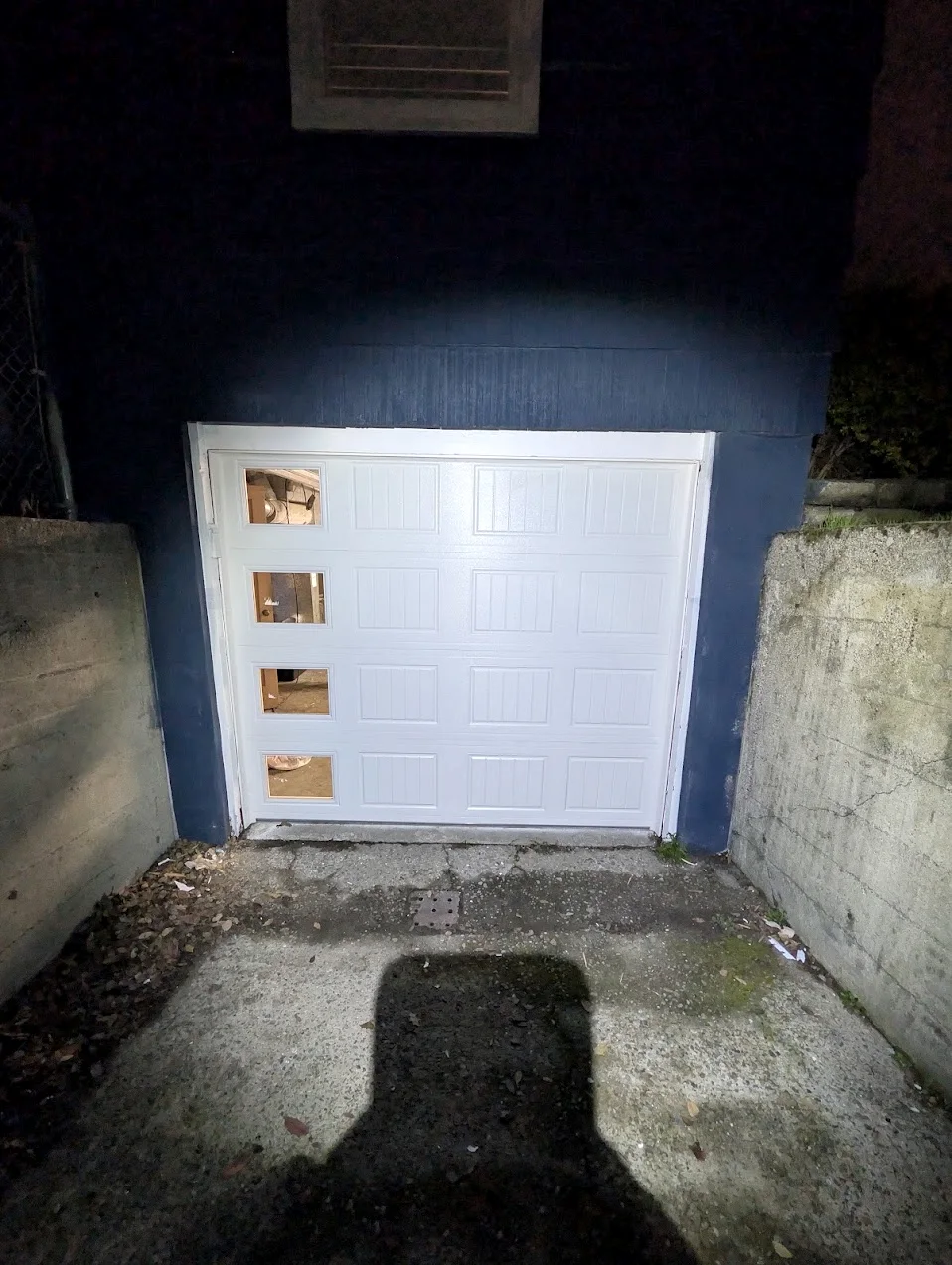 New white insulated garage door fitted on the same Tukwila home